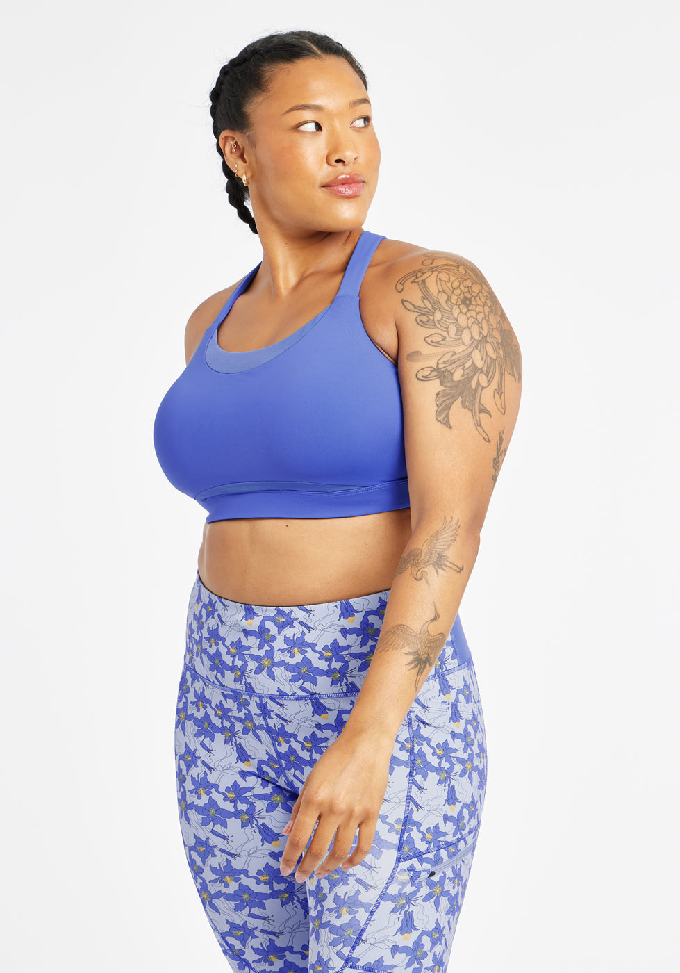 Woman wearing blue band and cup sports bra, alternate front view