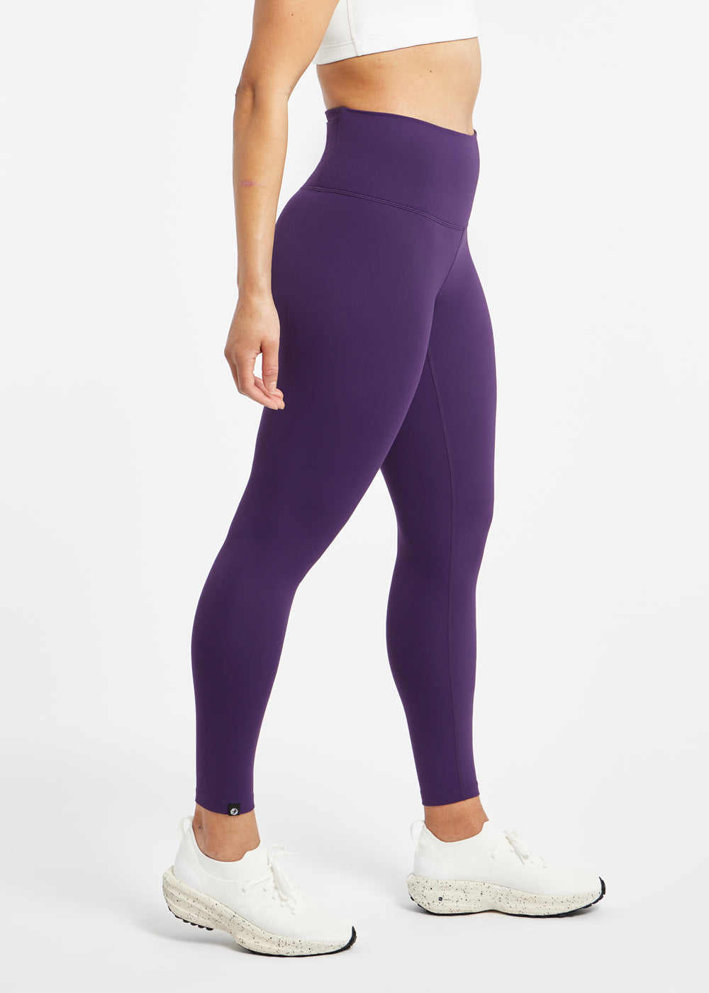 Essential Bird 7/8 length Running Tights in Twilight purple, side view