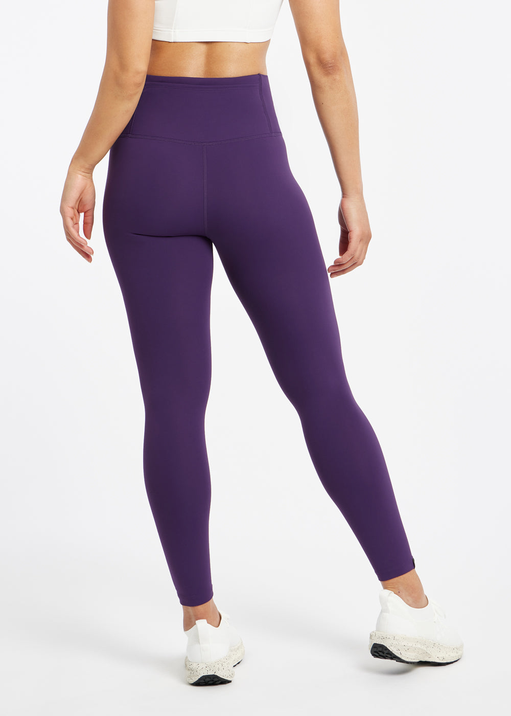 Essential Bird 7/8 length Running Tights in Twilight purple, back view