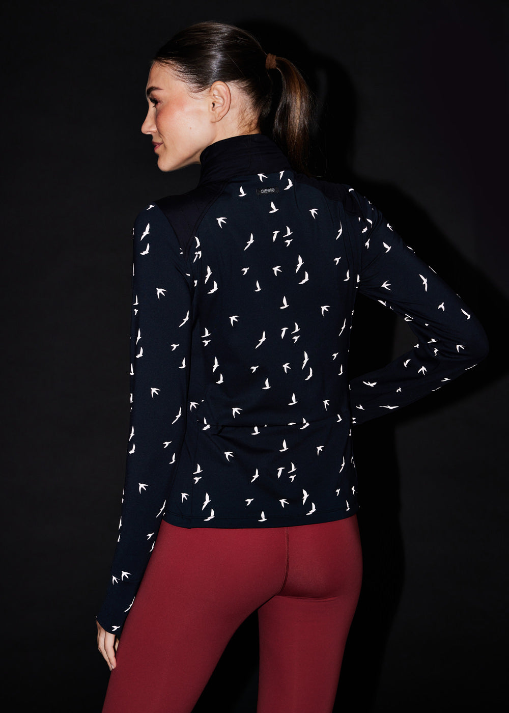 Firecracker Insulated Running Jacket in black, reflective back