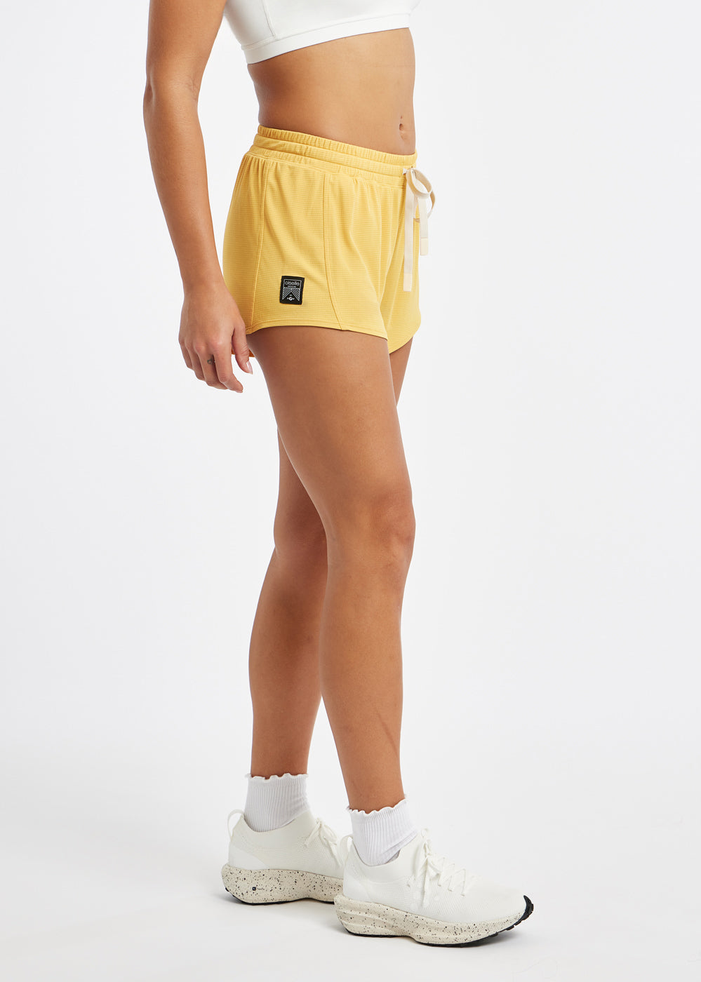 Flyout Chill Shorts in Dawn Patrol light yellow, side view