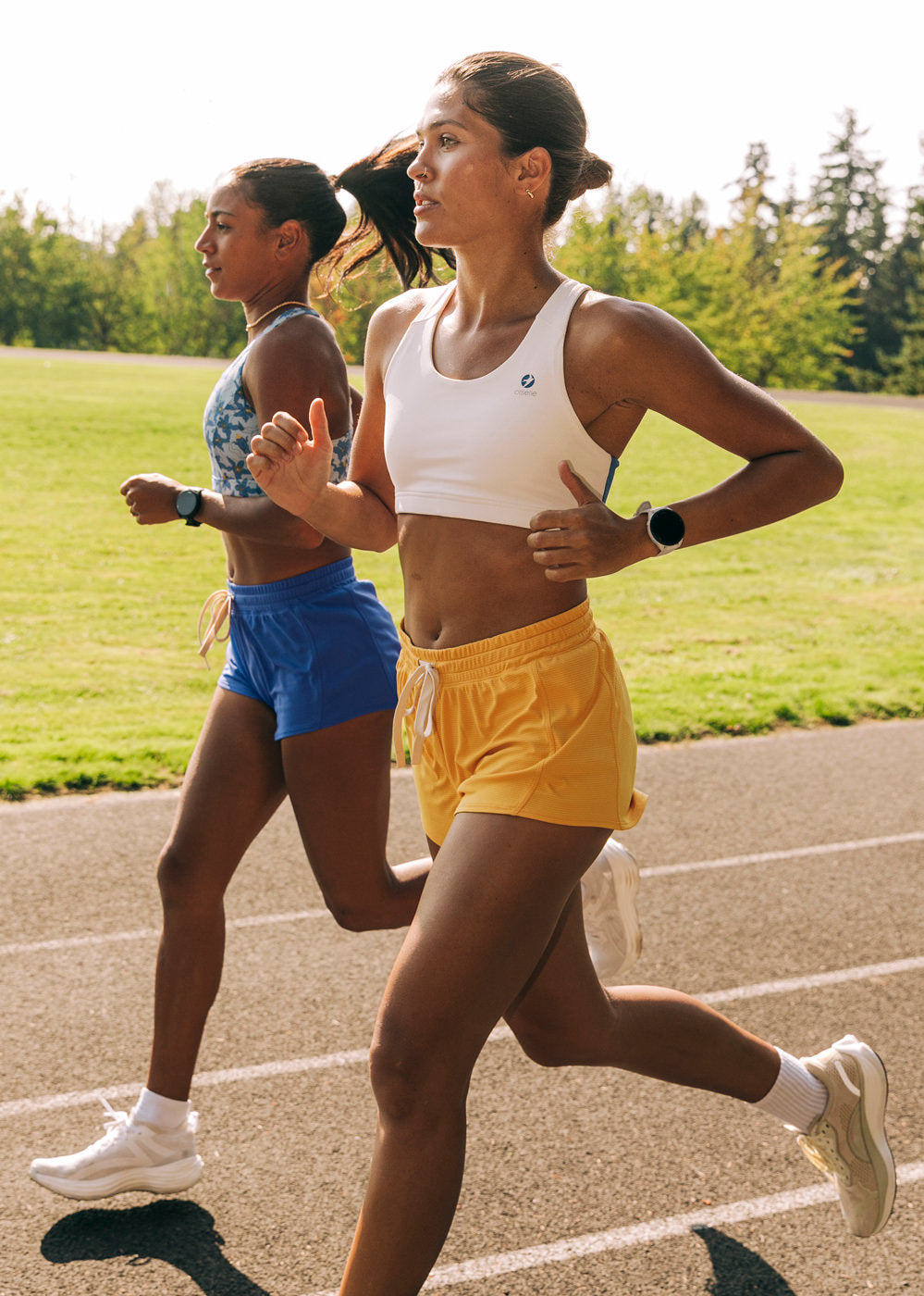 Flyout Chill Shorts in Dawn Patrol light yellow, woman running on a track