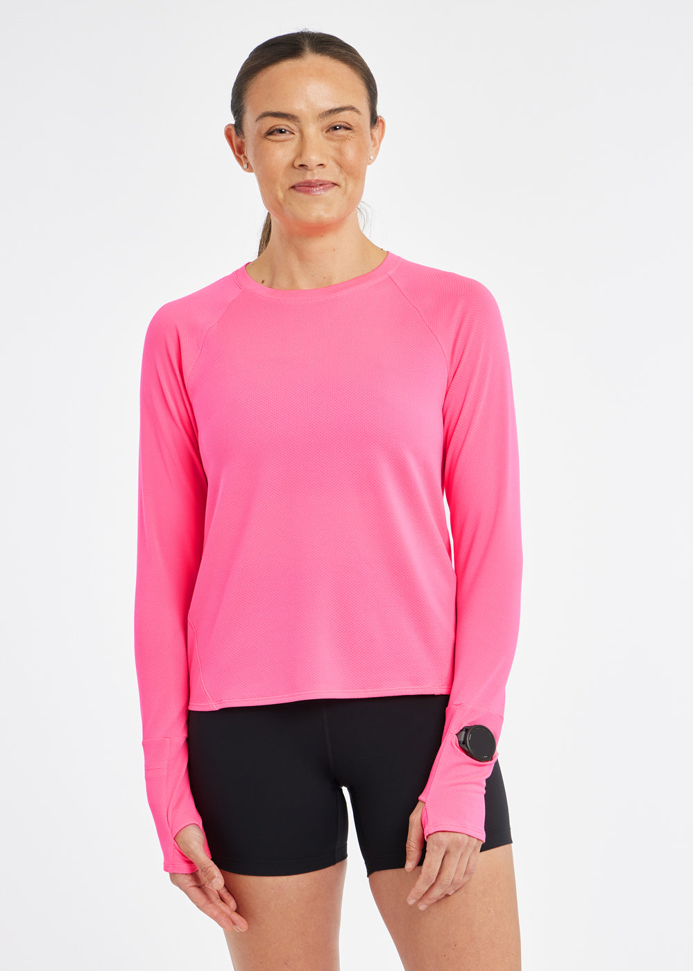 Flyout Long Sleeve in Neon Pink, front view with watch window on sleeve