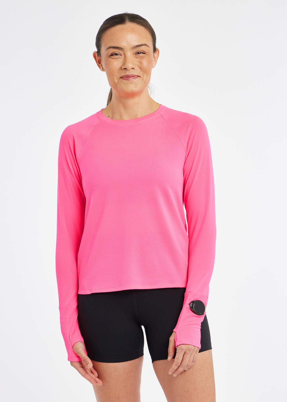 Flyout Long Sleeve in Neon Pink, front view with watch window on sleeve