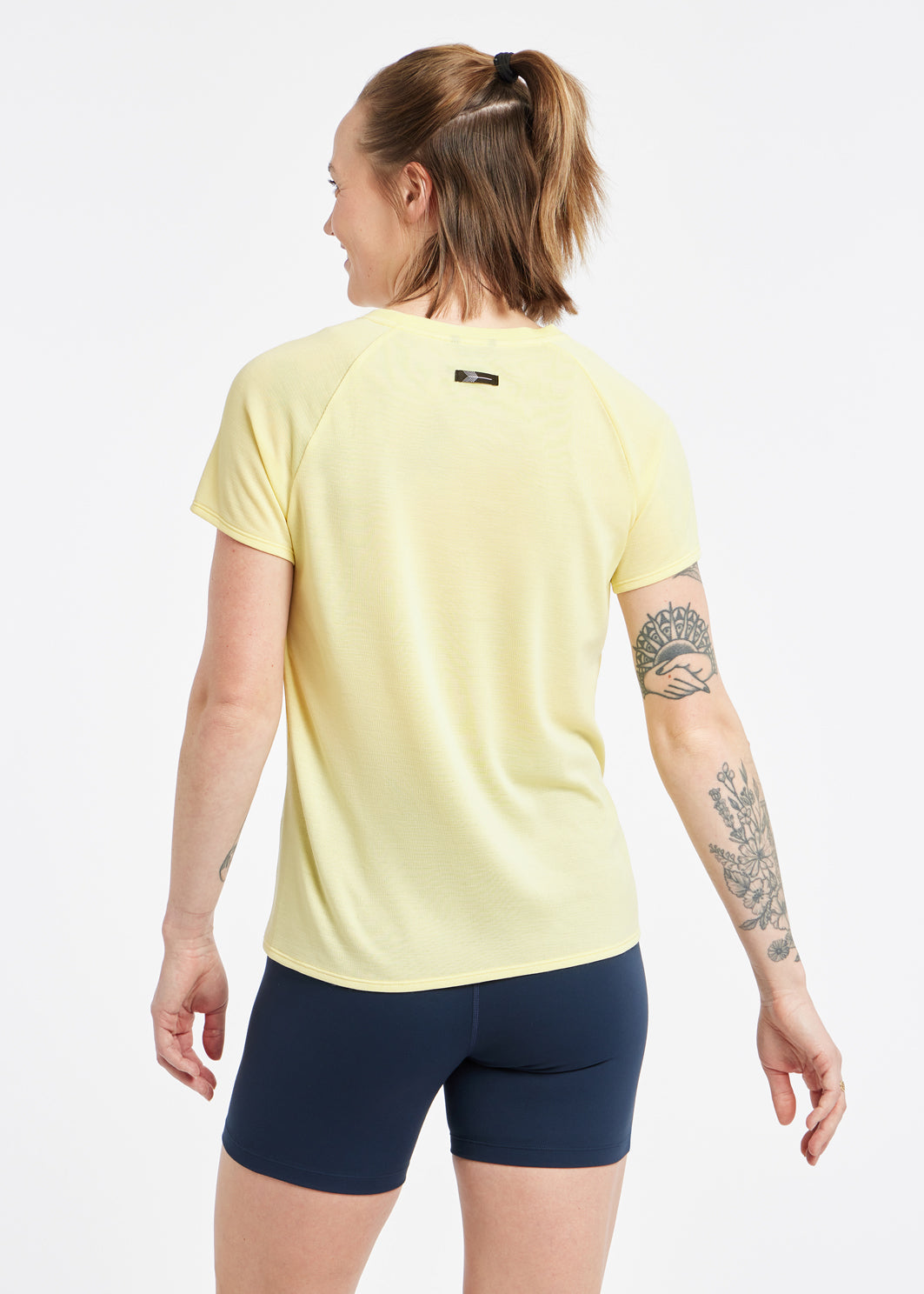 Flyout Wool Classic Short Sleeve in Rise light yellow, back view