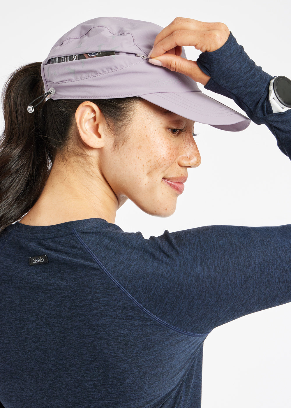 Foldable Roga Running Cap in light purple, side zip pocket view
