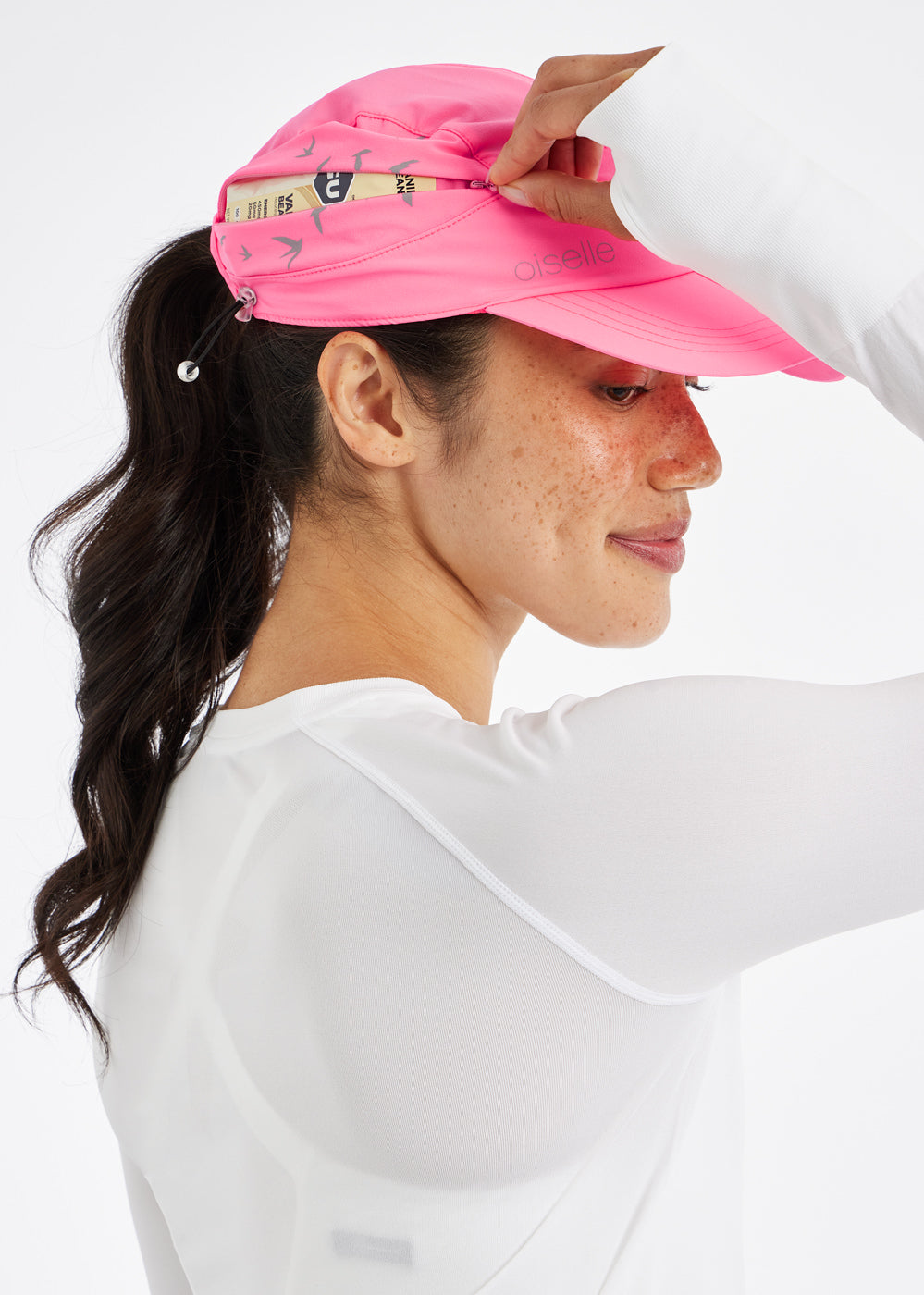Foldable Roga Running Cap in Neon Pink, side zip pocket view