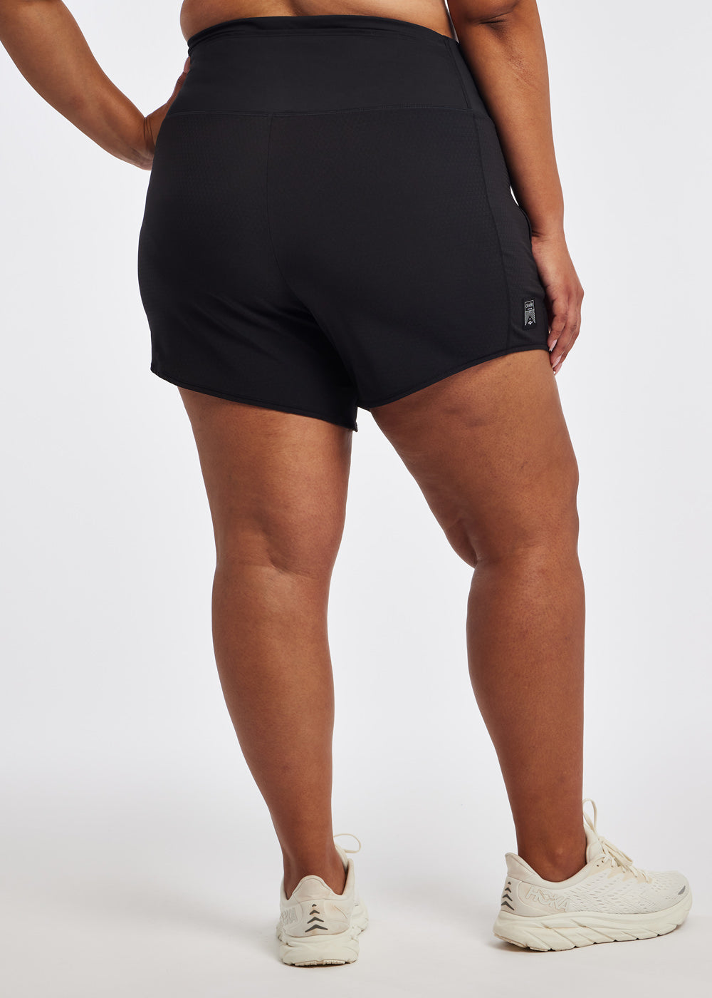 High Rise Long Roga Shorts in Black, back