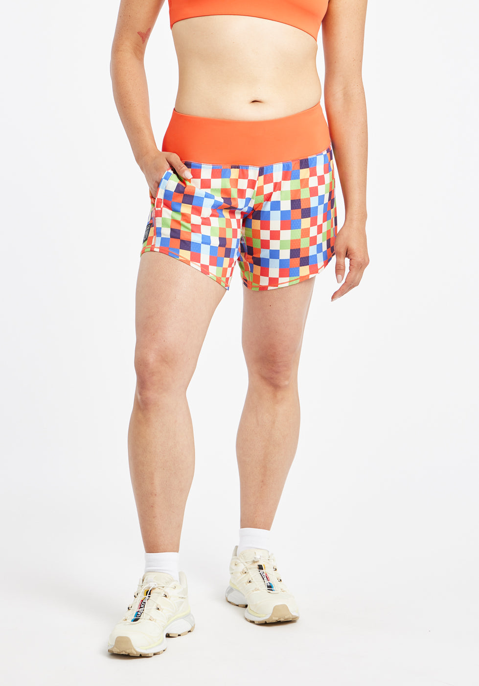 Roga 6" Running Shorts in colorful checkered print with orange waistband, alternate front view
