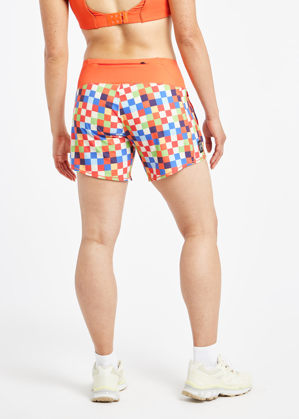 Roga 6" Running Shorts in colorful checkered print with orange waistband, back view