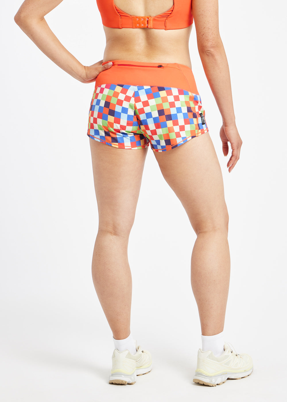 Roga 1.75" Running Shorts in colorful checkered print with orange waistband, back view