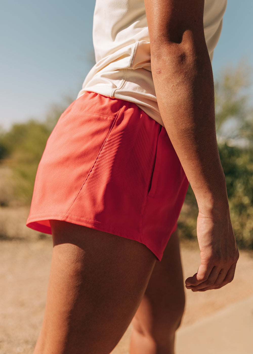 OG Distance 3.25" Running Shorts in Alpenglow orange, side
