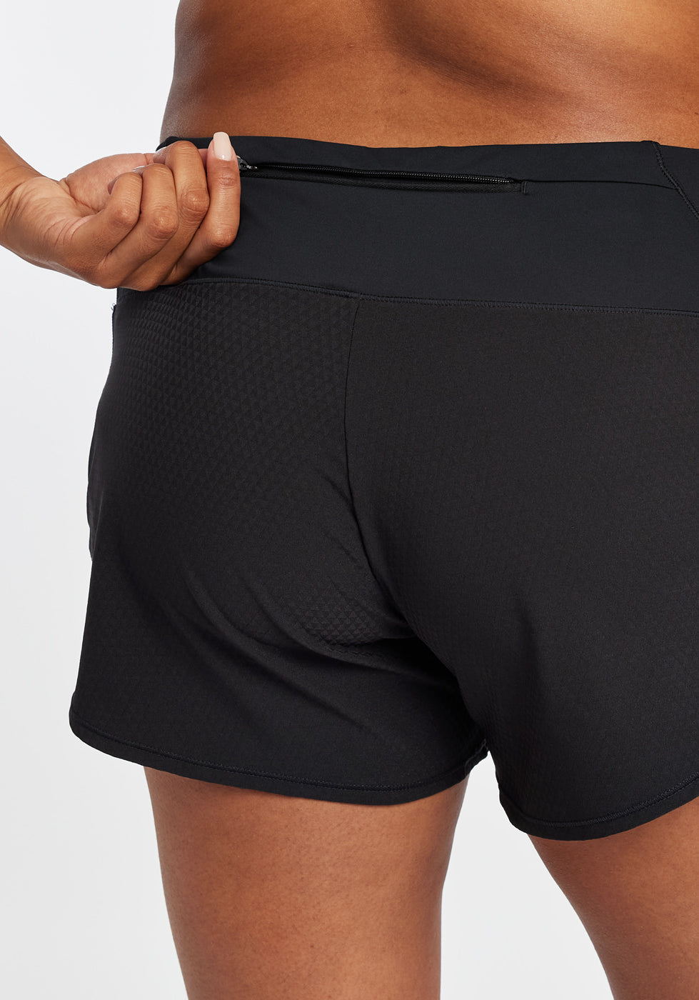 Roga Running Shorts in Black, rear zip waist pocket detail view