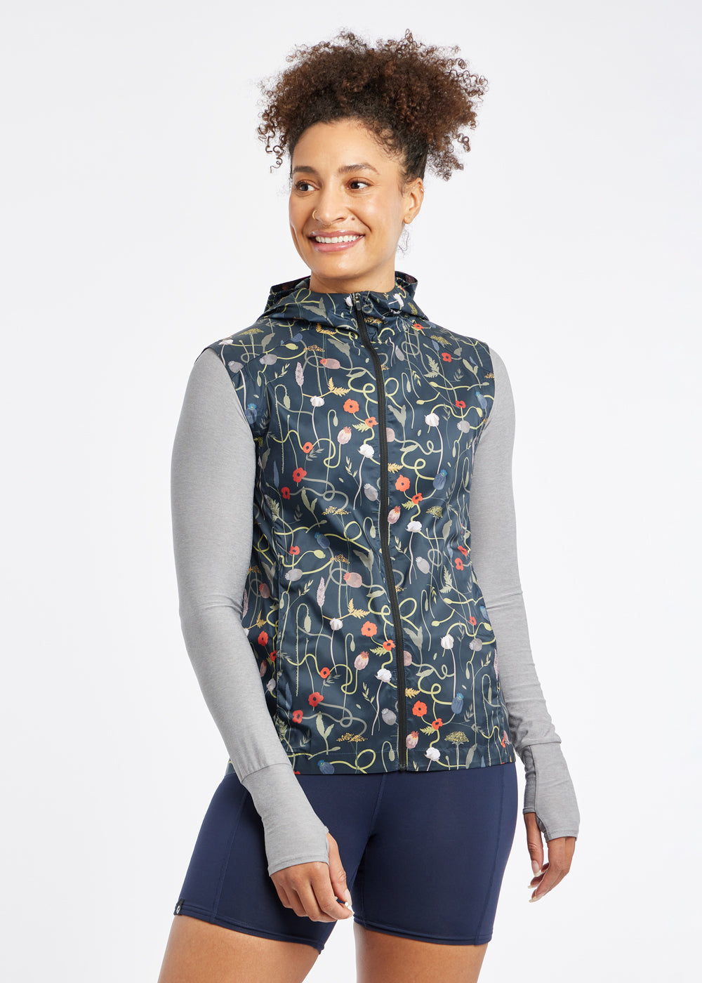 Whirlwind Vest, a wind resistant running vest in black print, front view