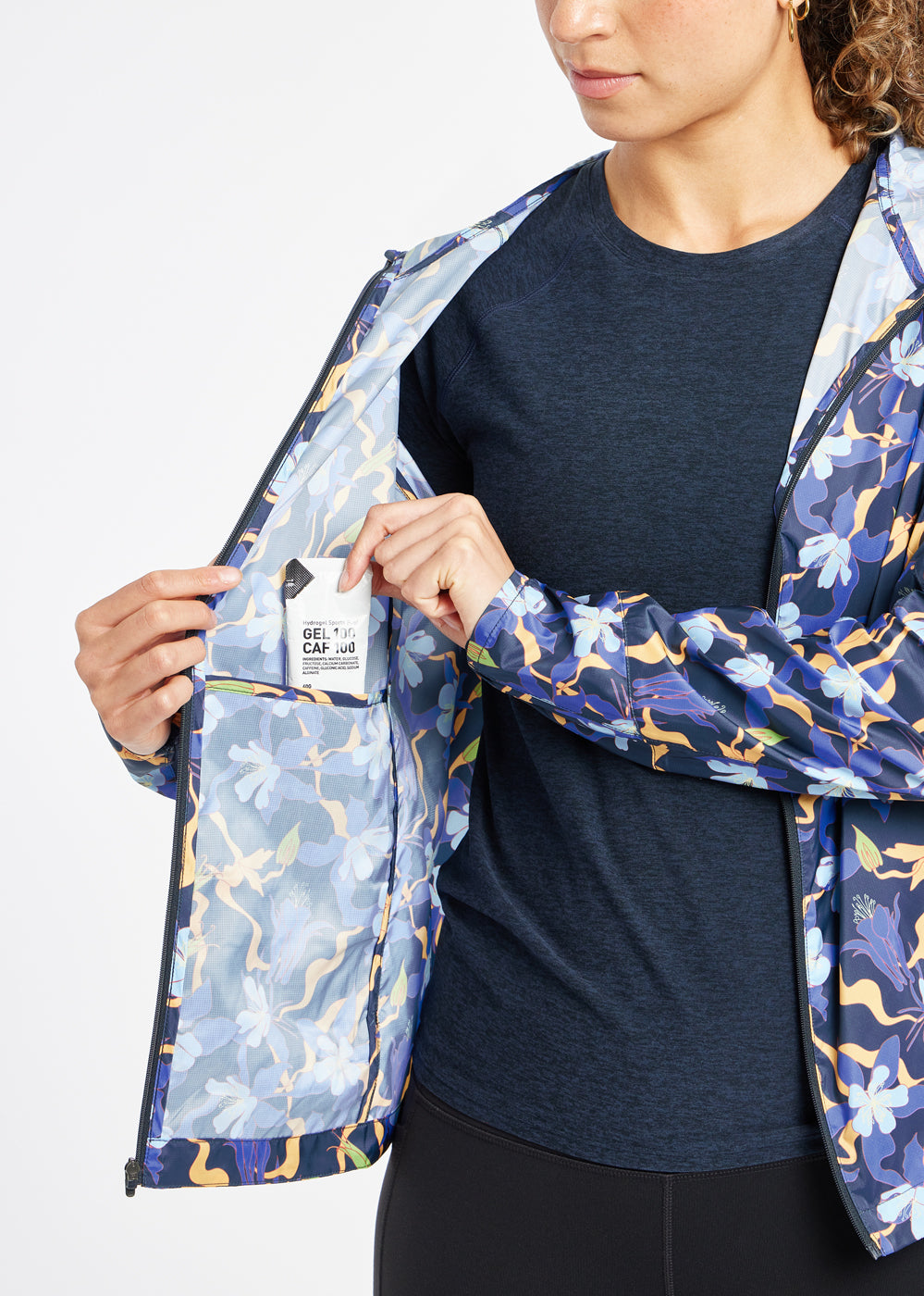 Whirlwind Running Jacket in Ink Blue Aquila Bloom Floral Print, interior pocket detail view