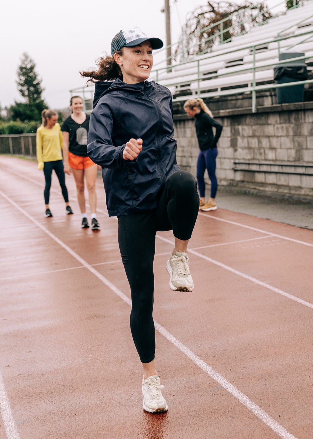 Whirlwind Jacket, a wind resistant running jacket in Ink Blue, running view