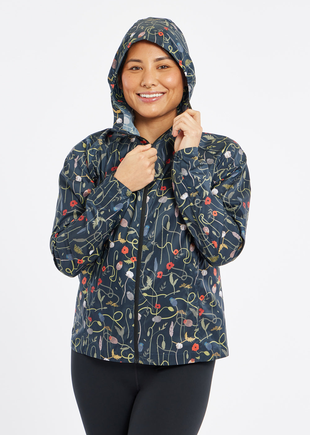 Whirlwind Jacket, a wind resistant running jacket in flower print, front view with hood