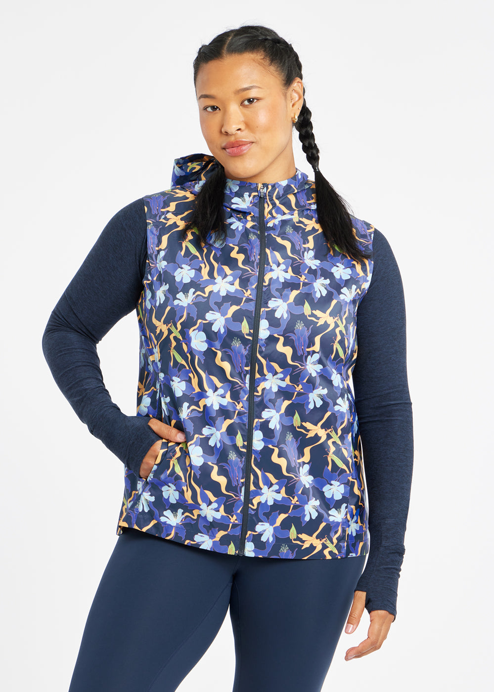 Whirlwind Running Vest in Ink Blue Aquila Bloom Floral Print, front view with hand in pocket