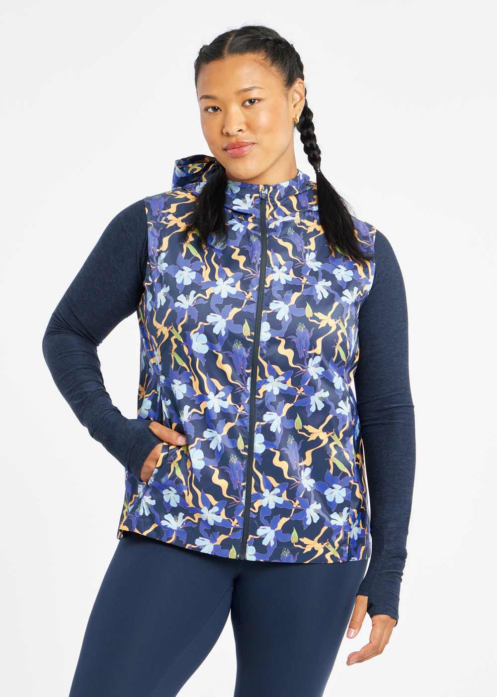 Whirlwind Running Vest in Ink Blue Aquila Bloom Floral Print, front view with hand in pocket