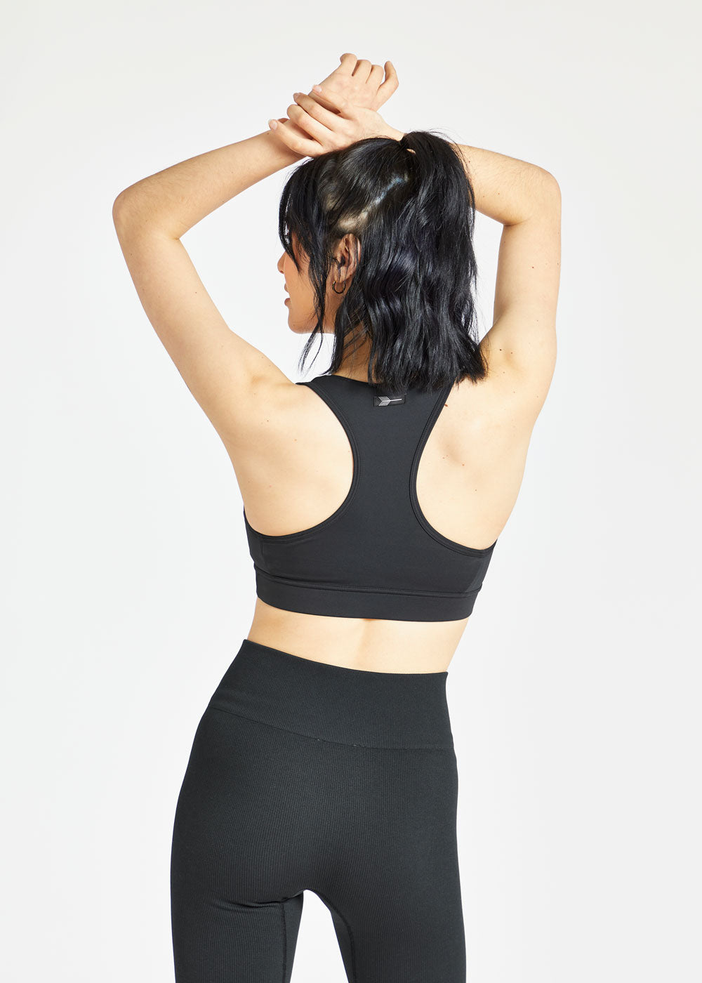 Double Breasted Sports Bra in Black, back view