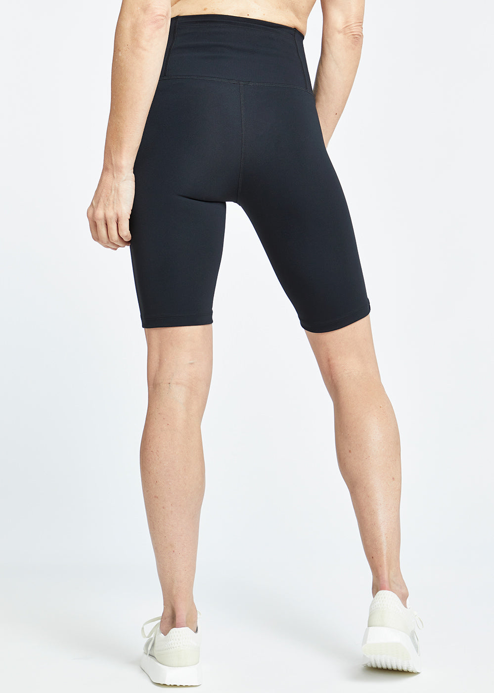 Essential Bird 9" Inseam compression shorts in Black, back view
