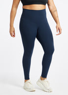 Essential Bird 7/8 length Running Tights in Ink Blue, front