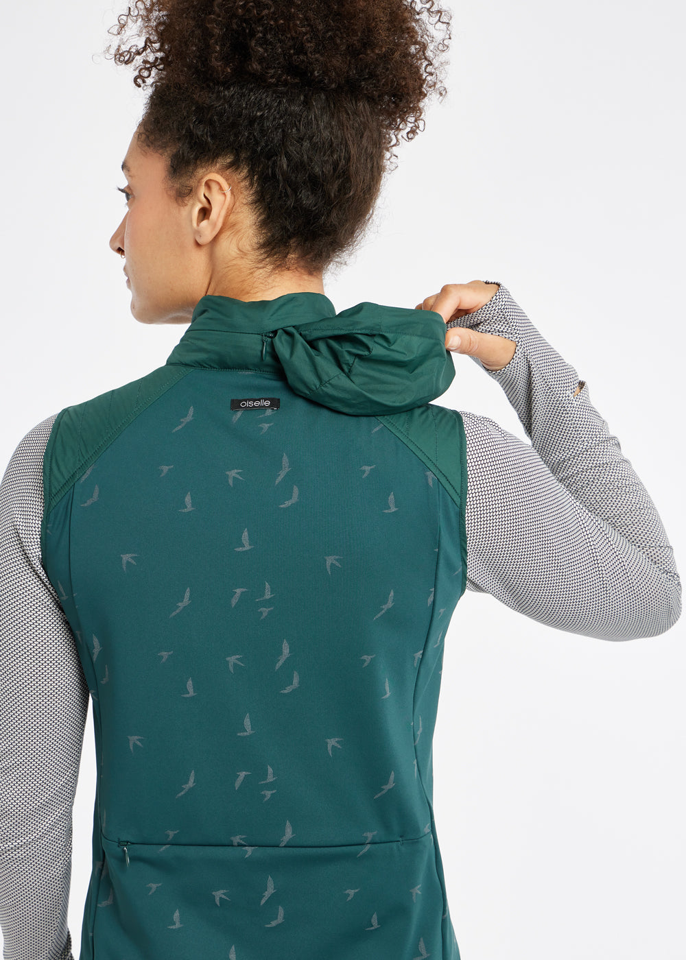 Firecracker Insulated Running Vest in Juniper green, packable hood