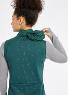 Firecracker Insulated Running Vest in Juniper green, packable hood