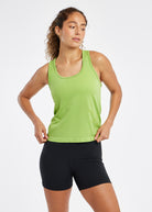 Woman wearing a green running tank top and black compression shorts, alternate front view