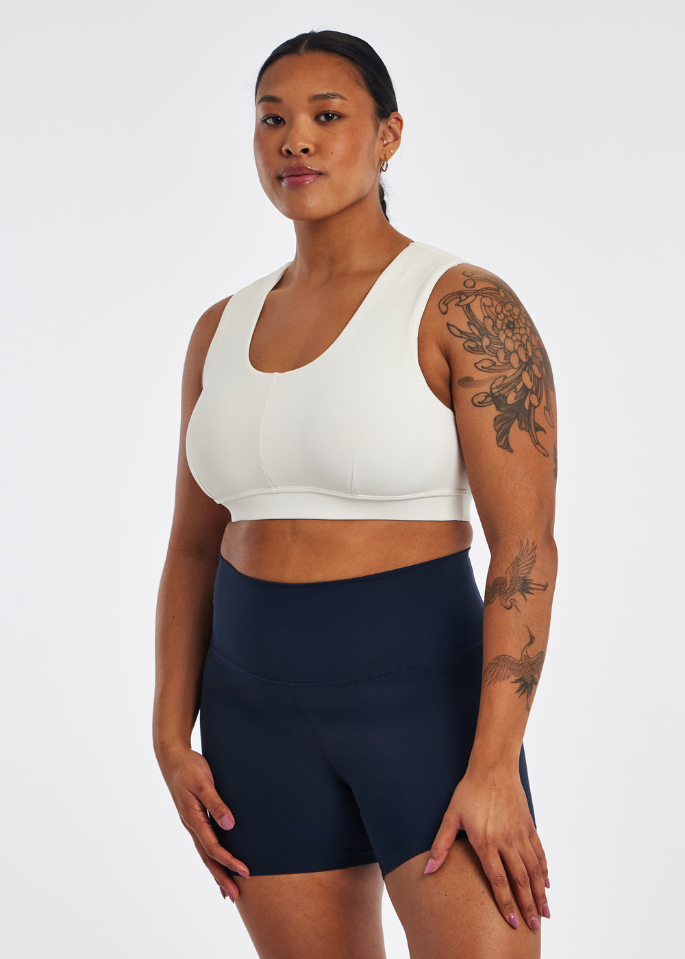 She has something to SMILE 😊 about! The Oiselle Pockito Bra is beautiful,  fits like a dream AND has pockets! Easily carry your phone o