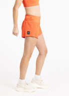 Running Shorts 4.25" inseam in orange, side view