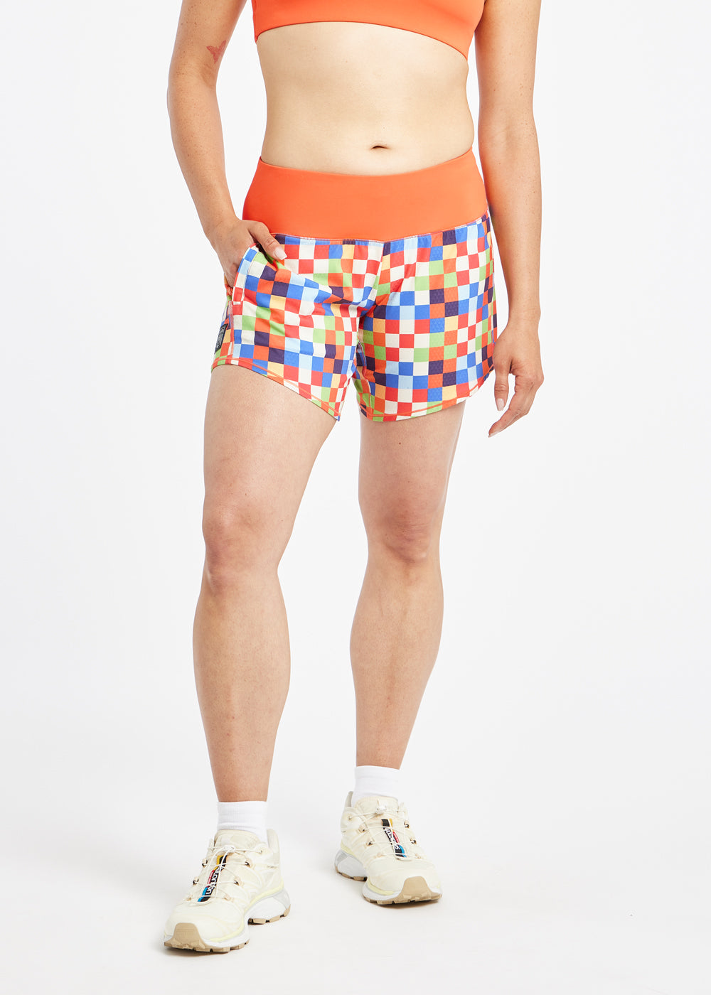 Roga 6" Running Shorts in colorful checkered print with orange waistband, alternate front view
