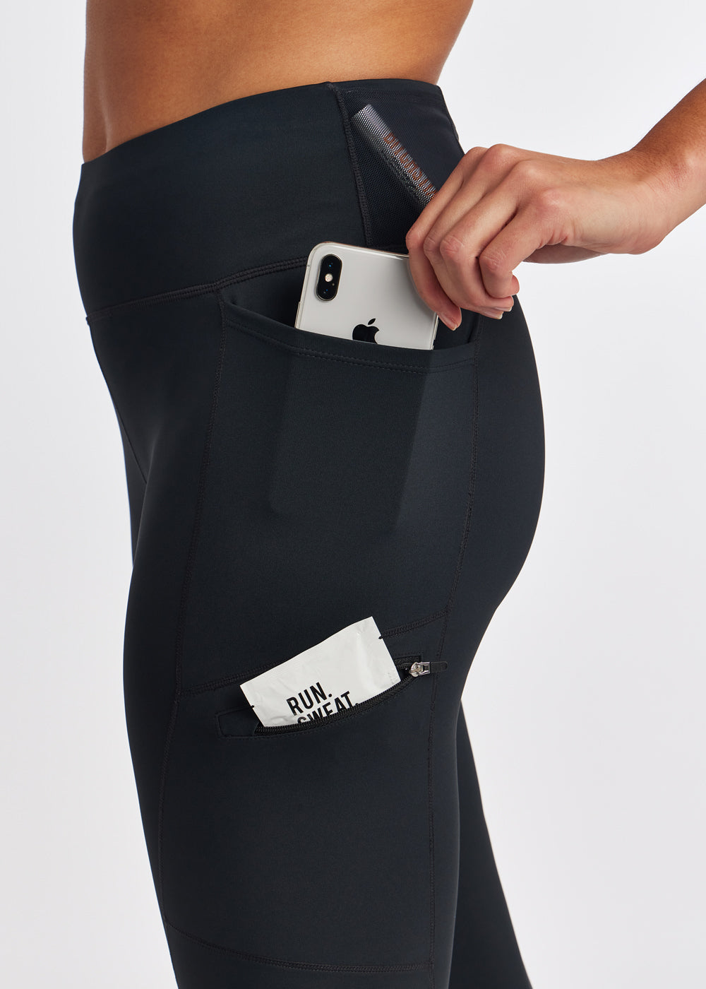 Woman wearing black knickers in size 4, close up view of side pockets