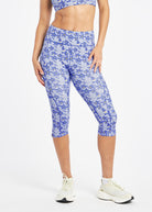 Woman wearing blue running knickers with blue flower print in size 6, front view