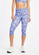 Woman wearing blue running knickers with blue flower print in size 6, alternate front view