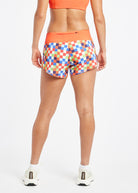 Roga 4" Running Shorts in colorful checkered print with orange waistband, back view
