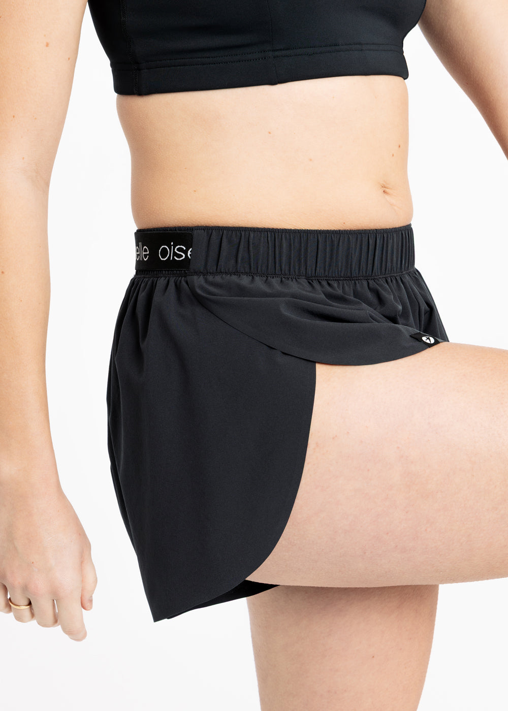 Close up of running shorts on the split side feature