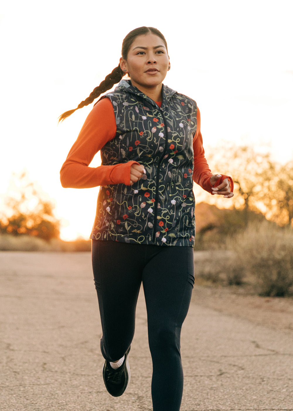 Whirlwind Vest, a wind resistant running vest in black print, running view