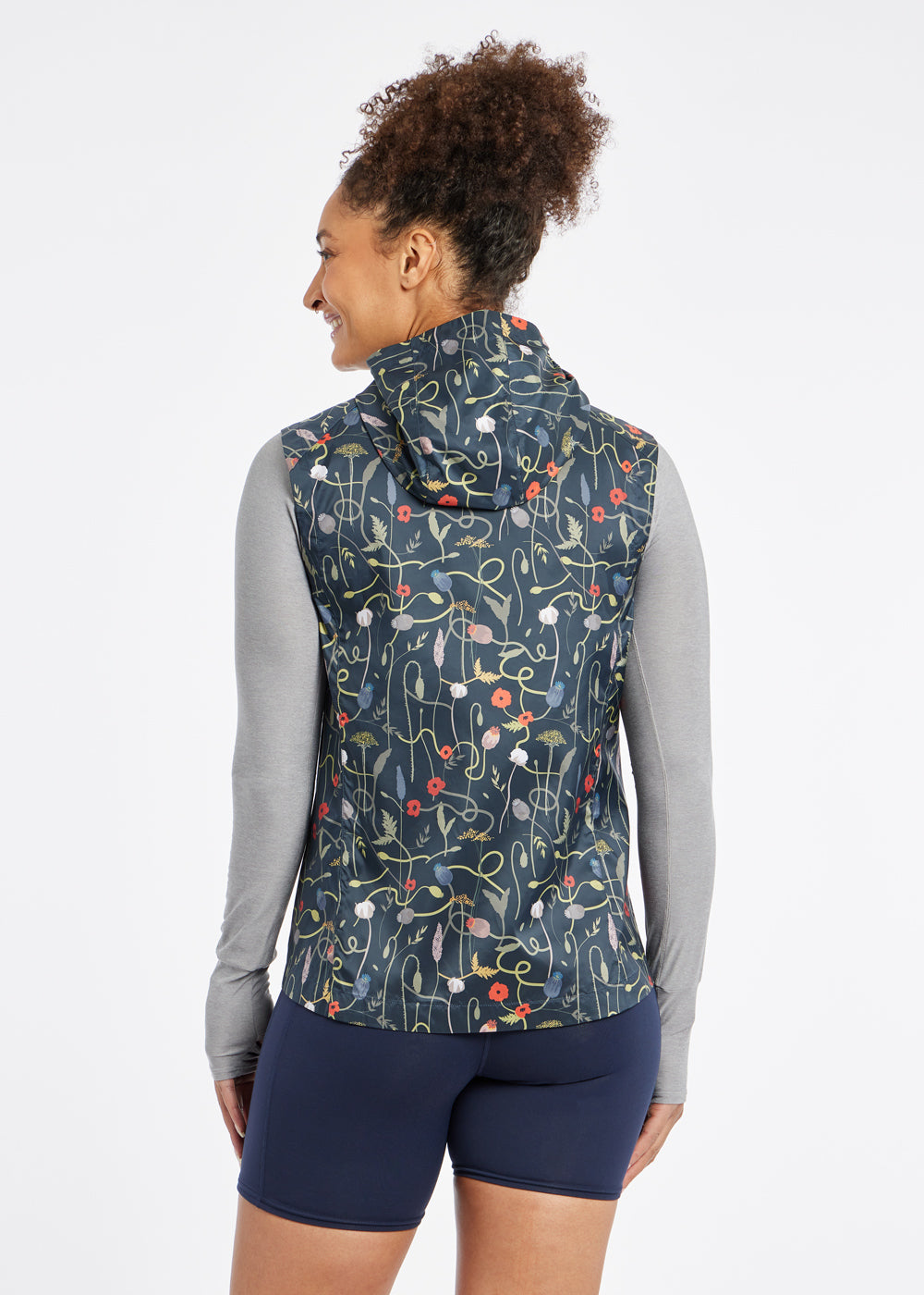 Whirlwind Vest, a wind resistant running vest in black print, back view