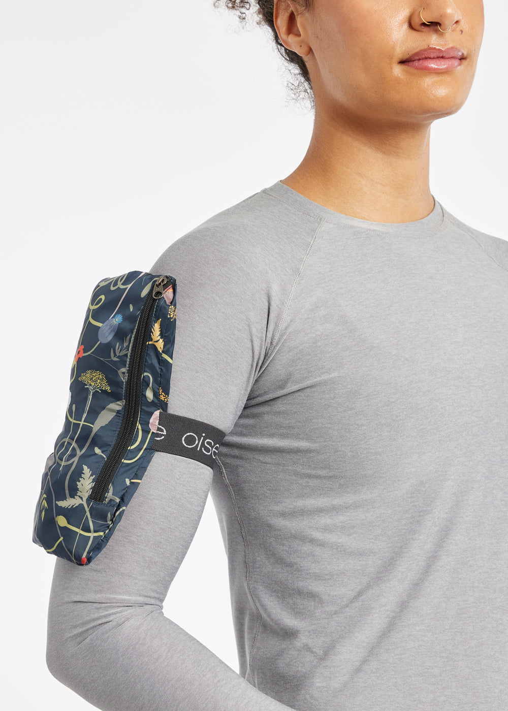 Whirlwind Vest, a wind resistant running vest in black print, packable