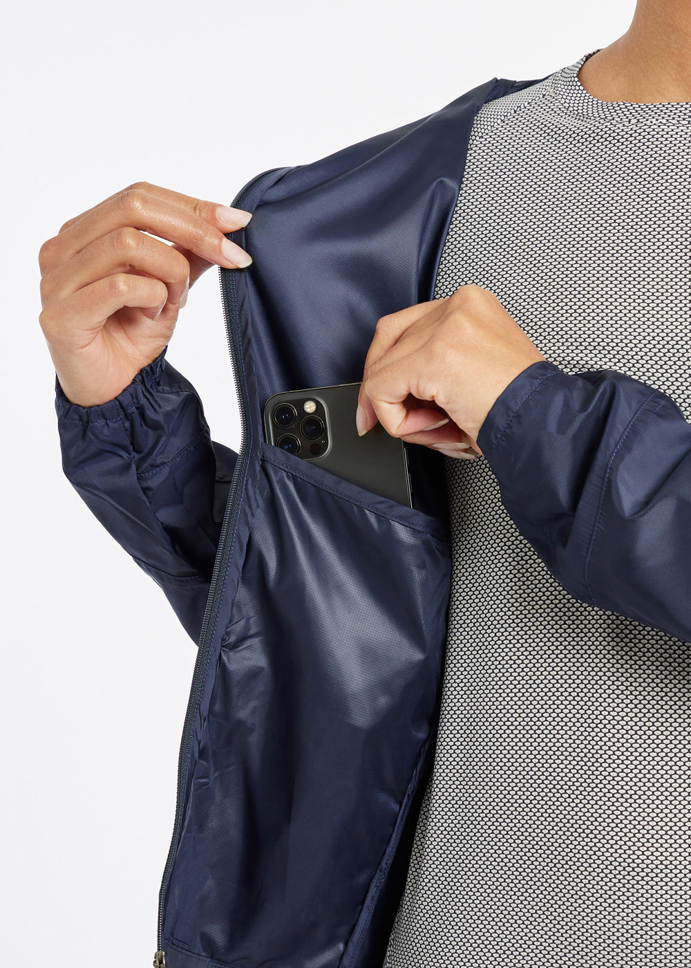 Whirlwind Jacket, a wind resistant running jacket in Ink Blue, detail pocket view