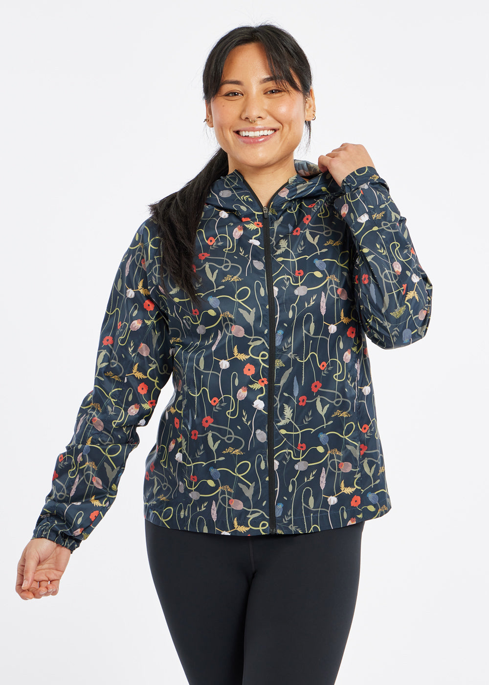 Whirlwind Jacket, a wind resistant running jacket in flower print, front view
