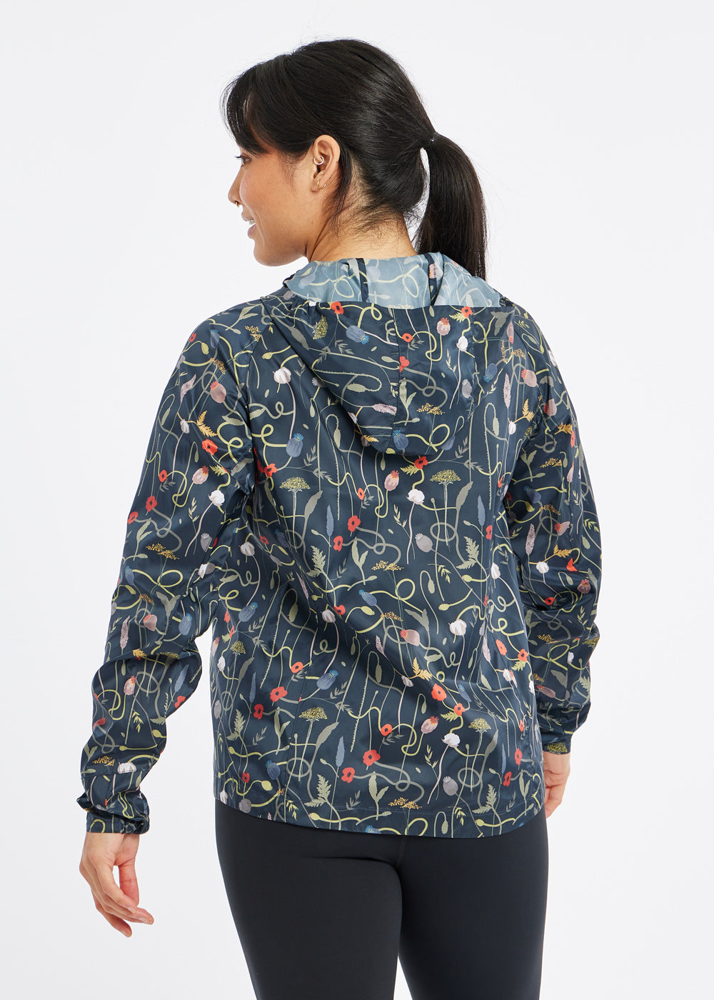 Whirlwind Jacket, a wind resistant running jacket in flower print, bacl view