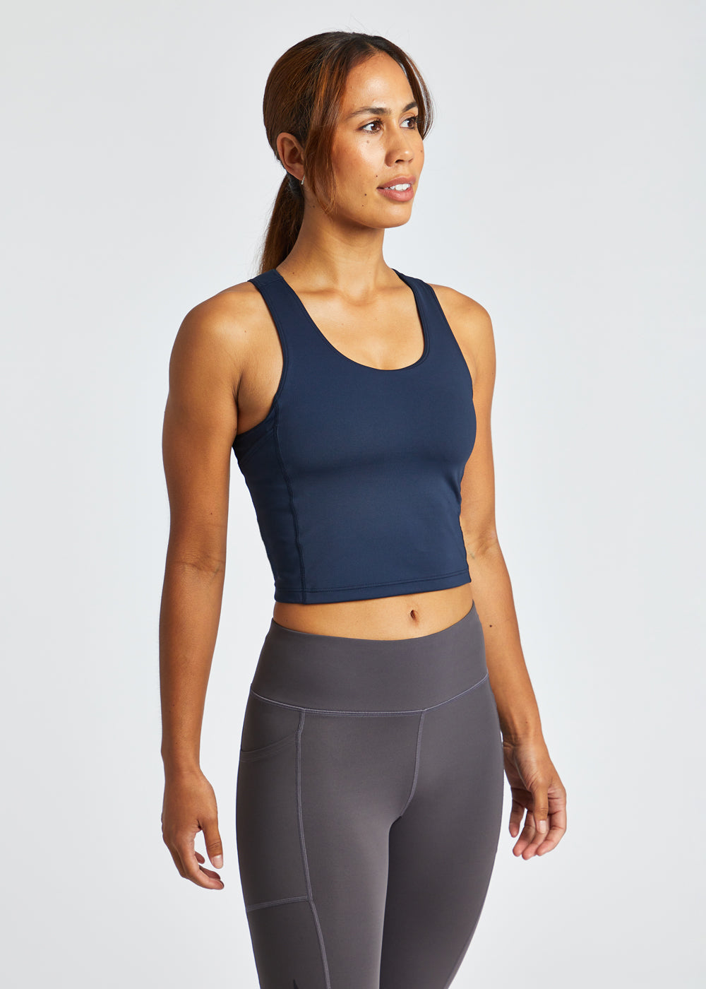 She has something to SMILE 😊 about! The Oiselle Pockito Bra is beautiful,  fits like a dream AND has pockets! Easily carry your phone o