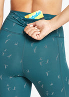 Firecracker Reflective Tights in Juniper green, back pocket detail